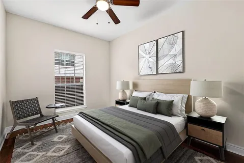 a bedroom with a bed and a window