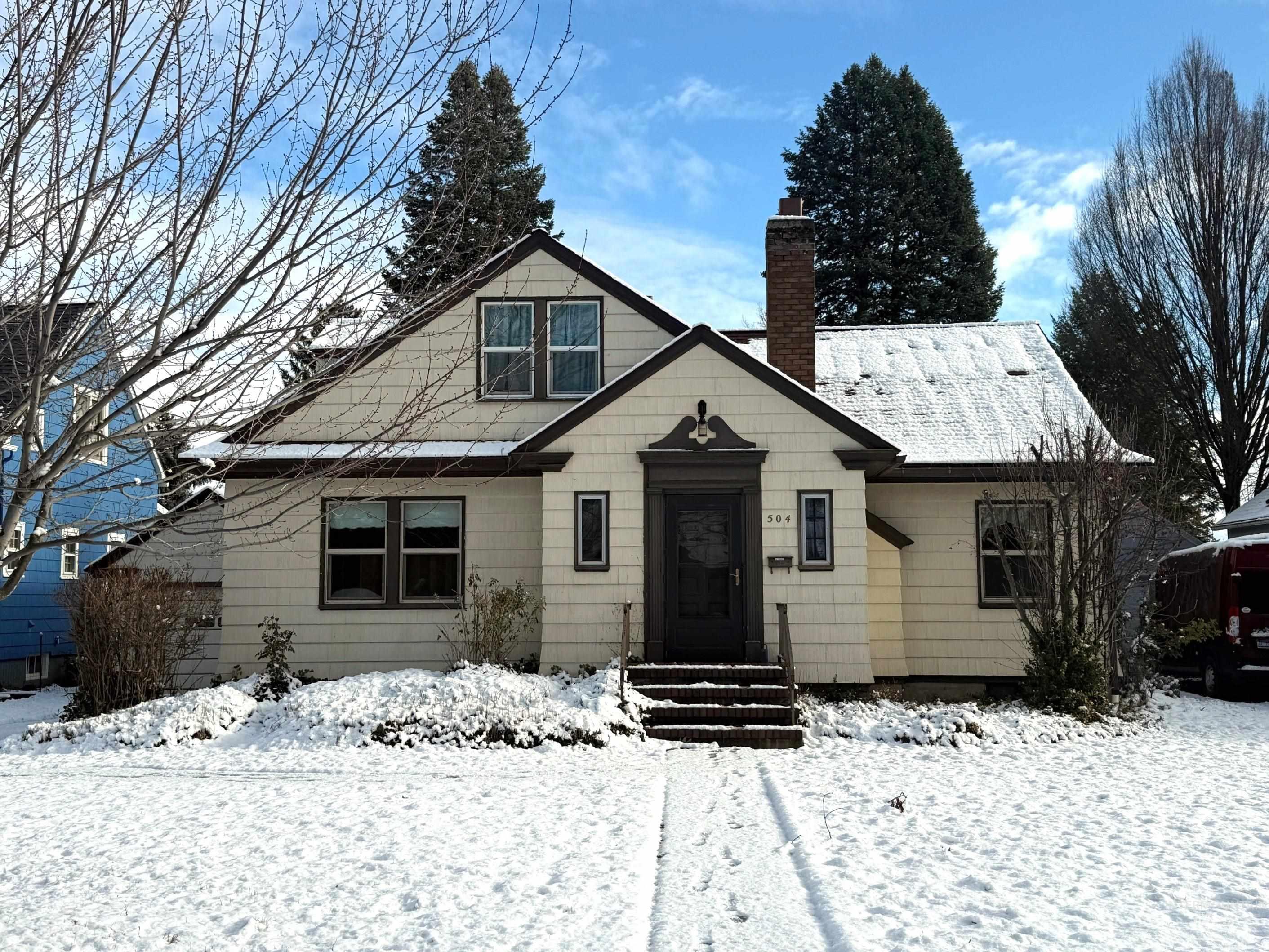 Bungalow-style house with a chimney
