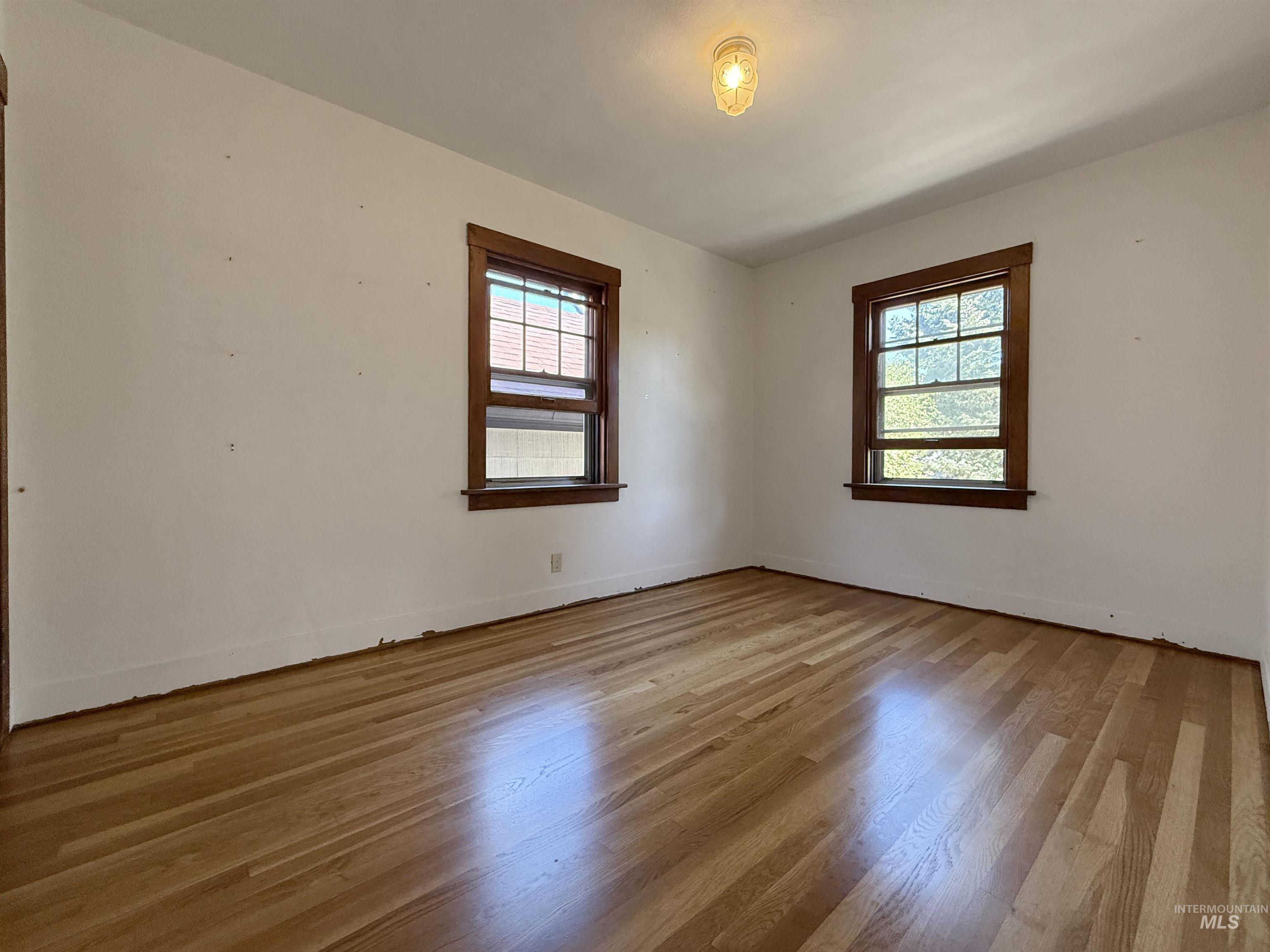 504 South Hayes Street Moscow, ID 83843 - Photo 14 of 44 Empty room with light wood-style floors and baseboards