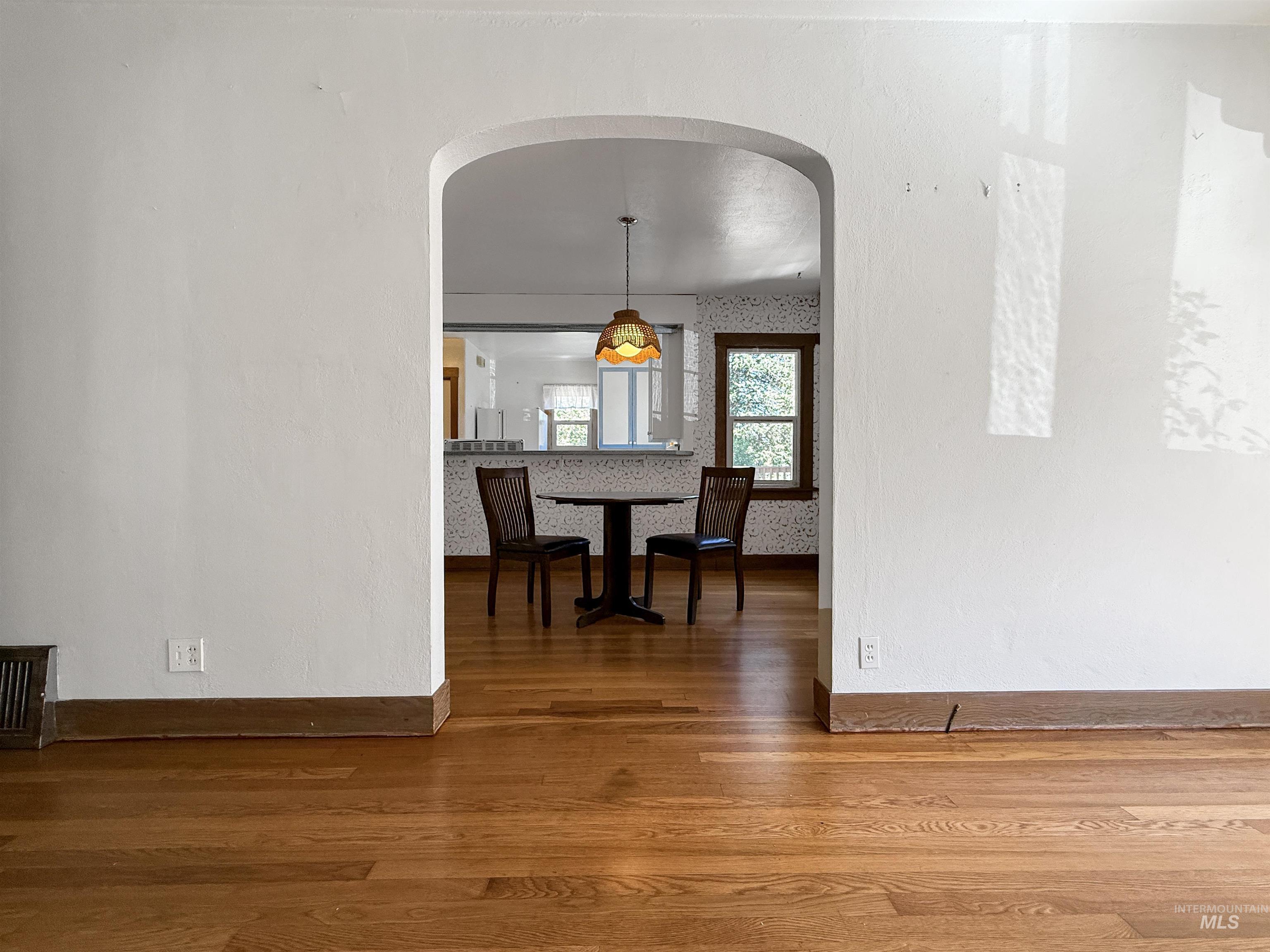 504 South Hayes Street Moscow, ID 83843 - Photo 19 of 44 Dining room with dark wood finished floors and arched walkways