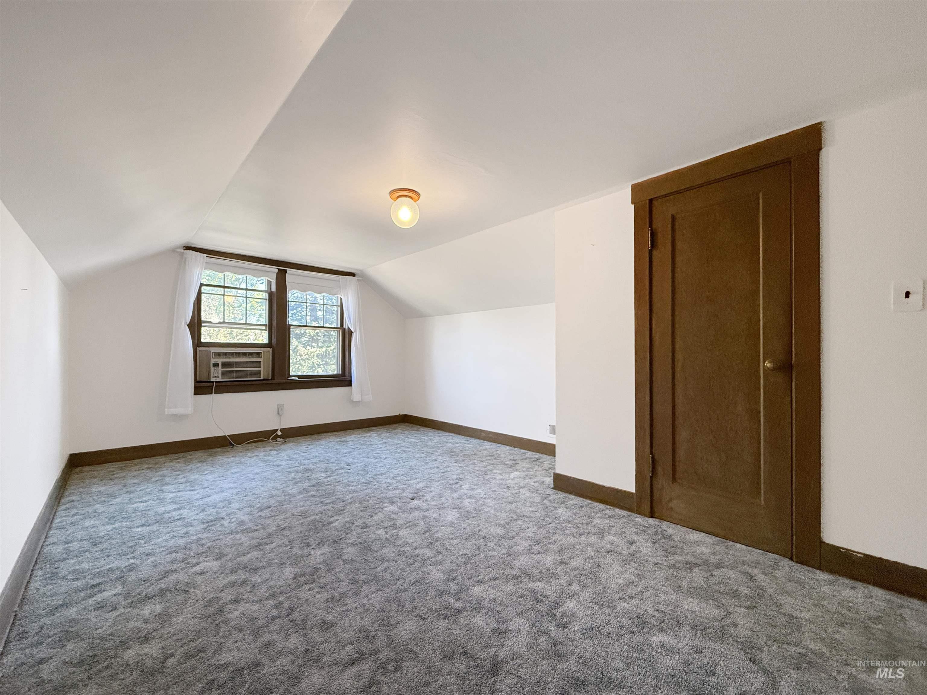 504 South Hayes Street Moscow, ID 83843 - Photo 25 of 44 Bonus room featuring carpet flooring and lofted ceiling