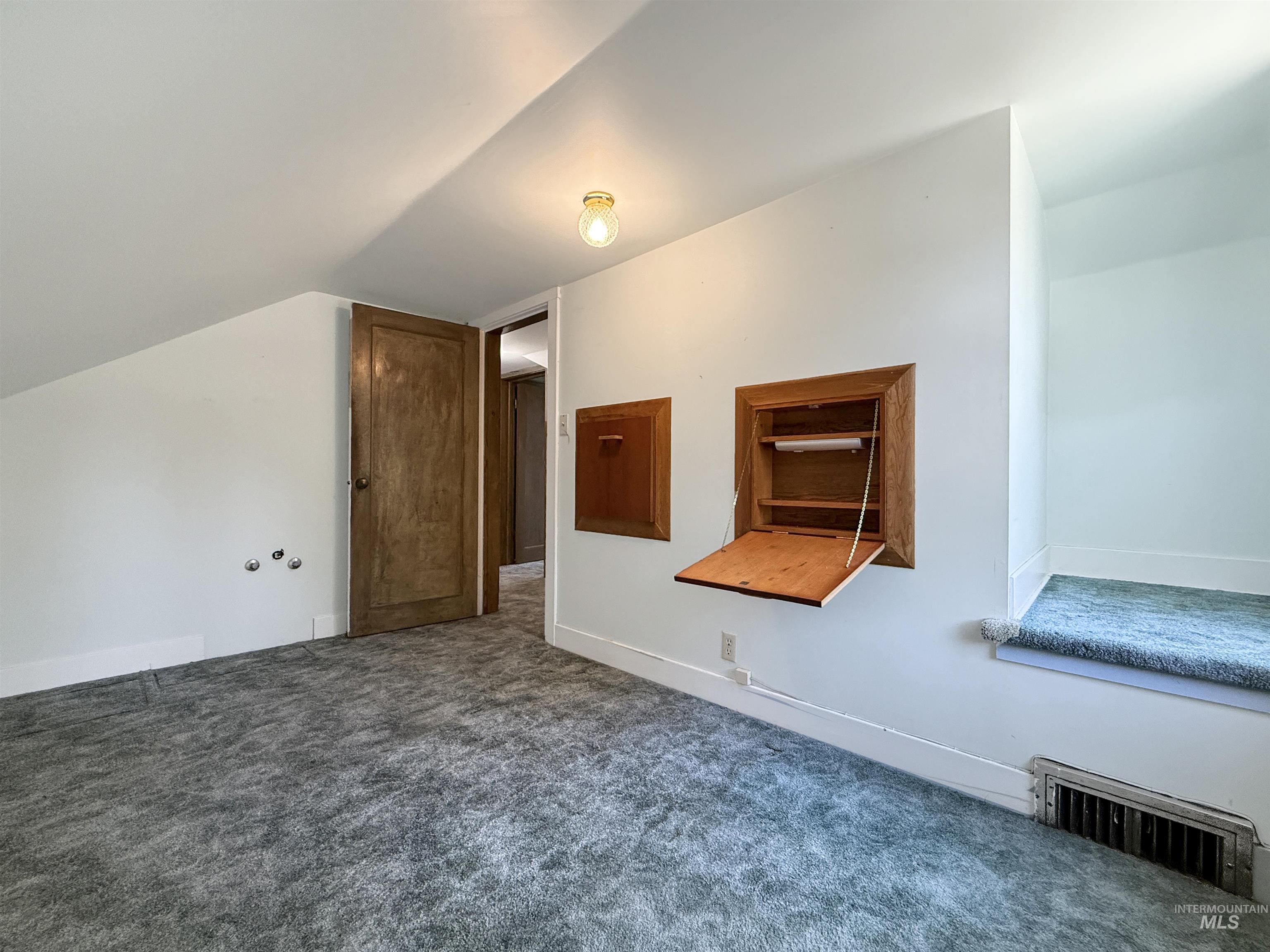 504 South Hayes Street Moscow, ID 83843 - Photo 30 of 44 Bonus room featuring dark carpet and baseboards