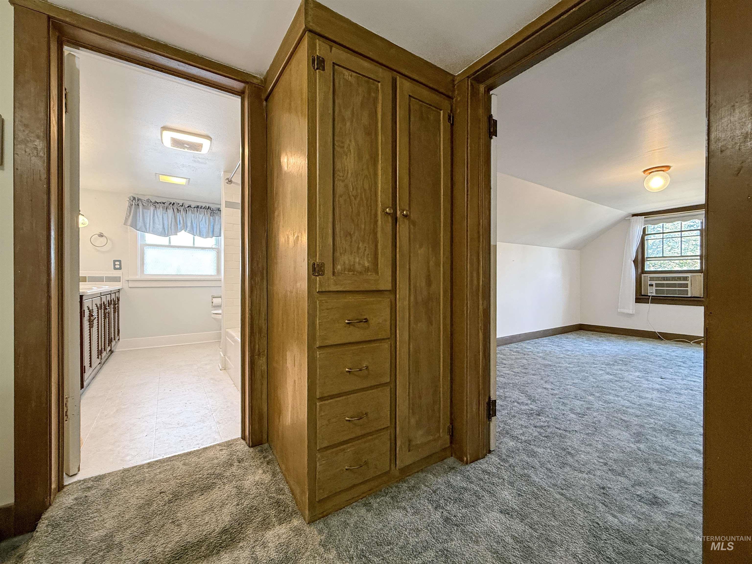 504 South Hayes Street Moscow, ID 83843 - Photo 31 of 44 Bonus room featuring light carpet and lofted ceiling