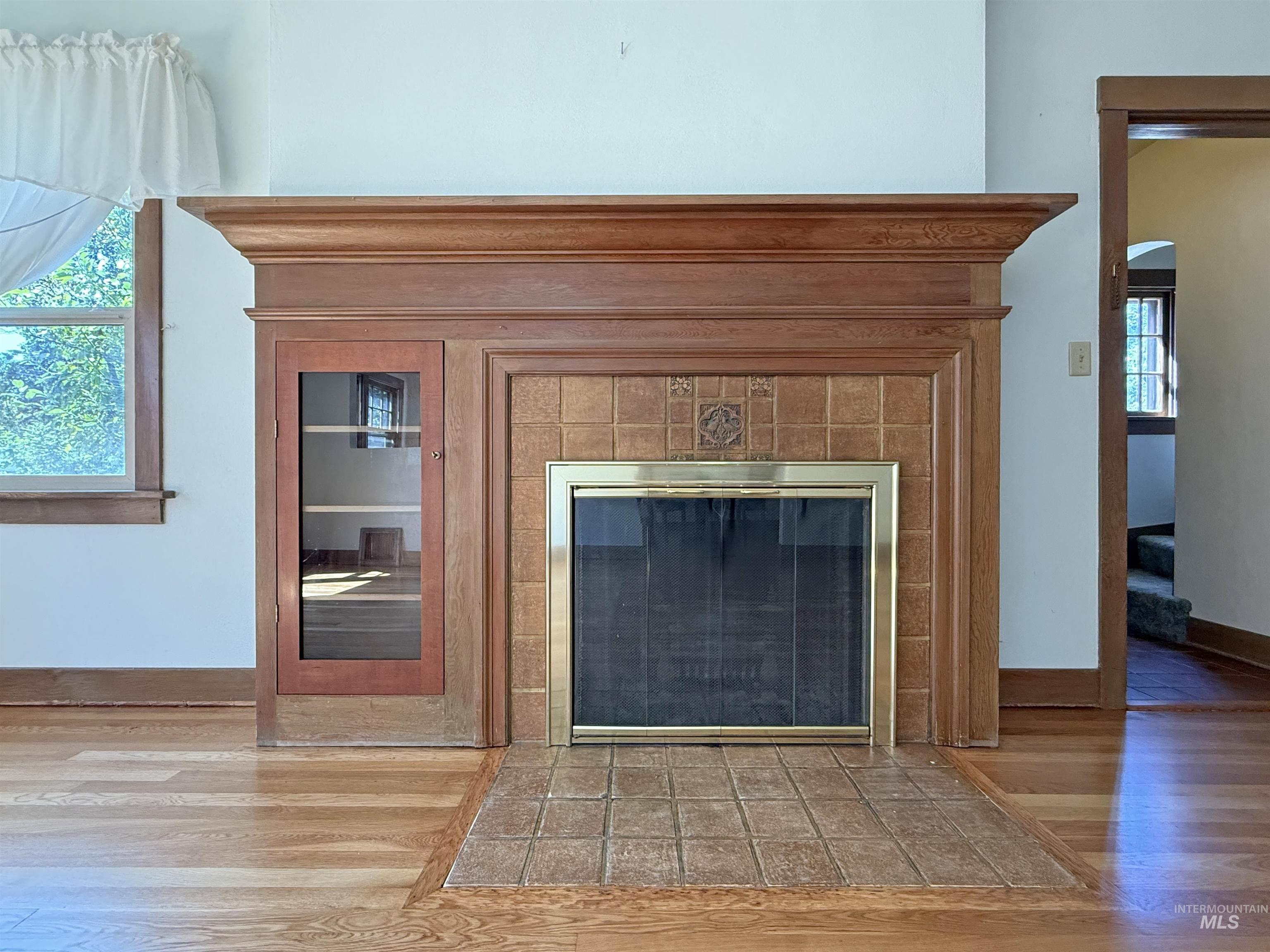 504 South Hayes Street Moscow, ID 83843 - Photo 6 of 44 Detailed view of wood finished floors and a tile fireplace