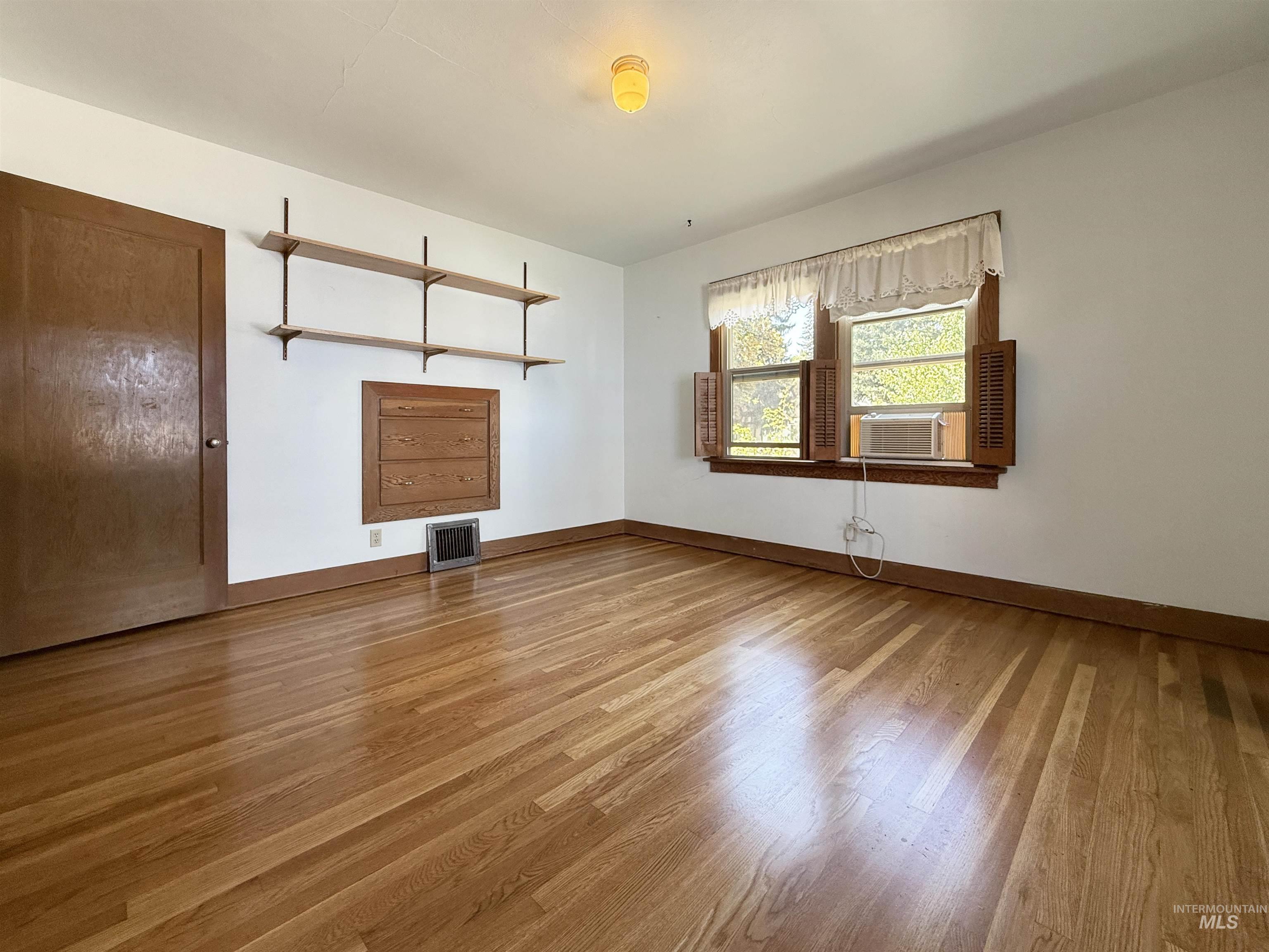 504 South Hayes Street Moscow, ID 83843 - Photo 9 of 44 Empty room with light wood finished floors