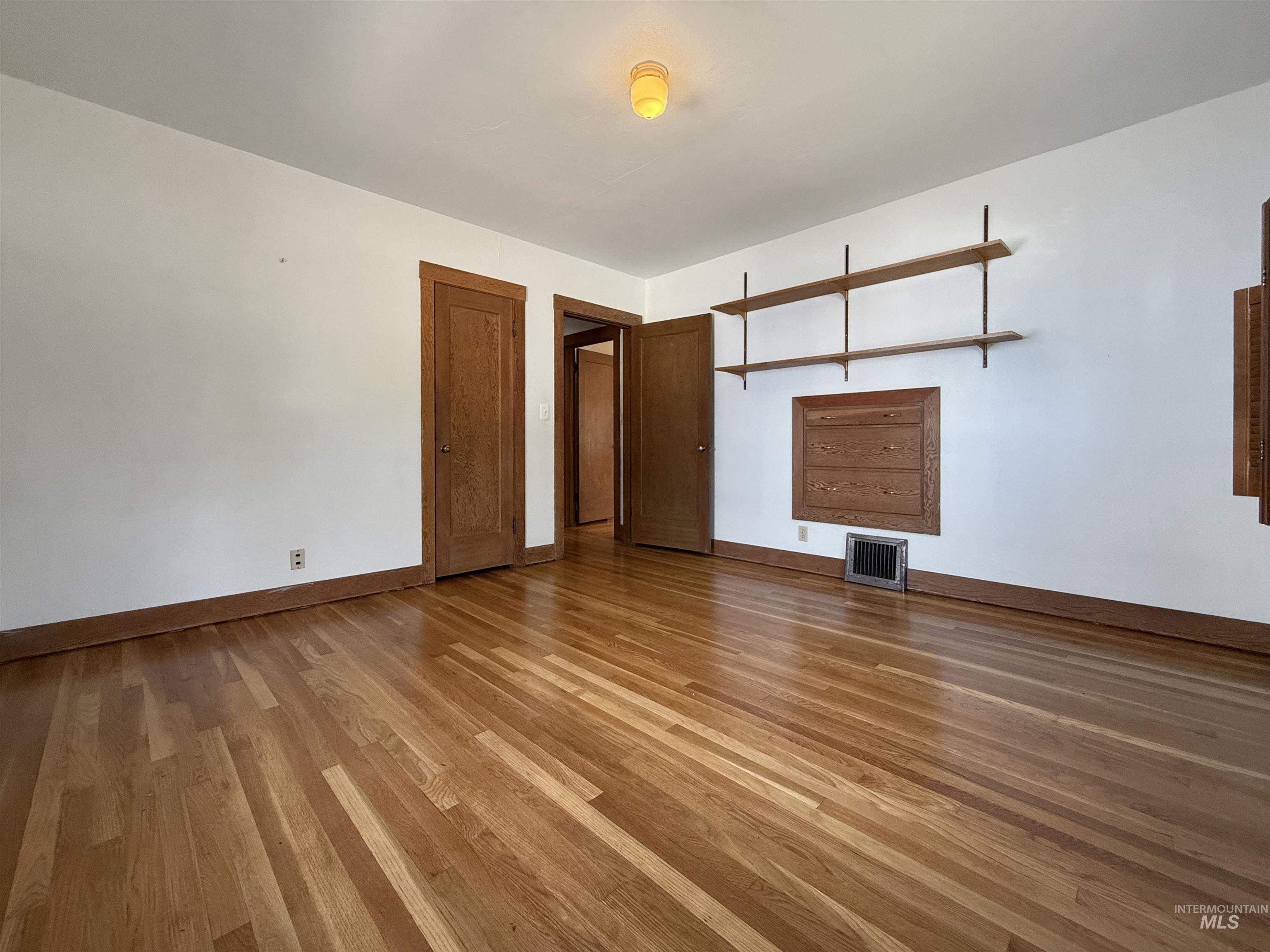 504 South Hayes Street Moscow, ID 83843 - Photo 10 of 44 Empty room featuring light wood finished floors and baseboards