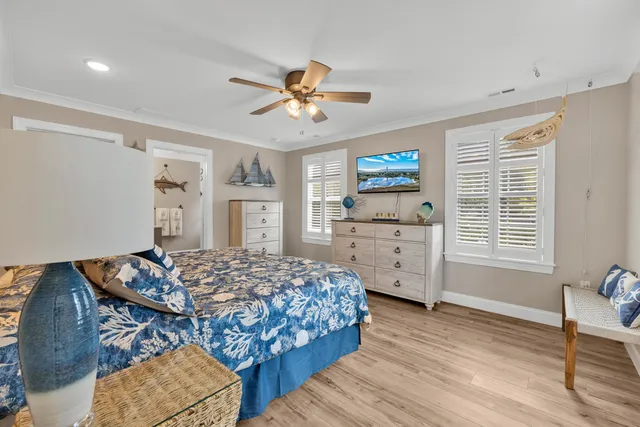 a bedroom with furniture and a window