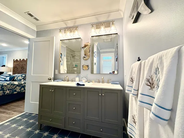 a bathroom with a double vanity sink and mirror