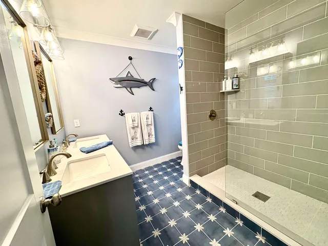 a bathroom with a sink and mirror