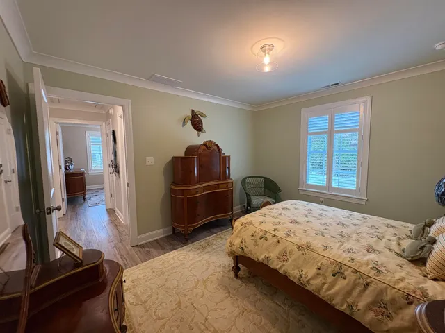 a bedroom with a bed and dresser