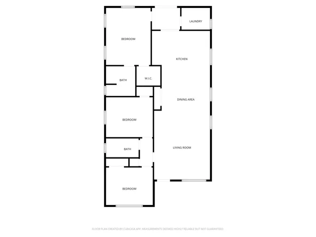 a view of a house with a small yard and wooden fence
