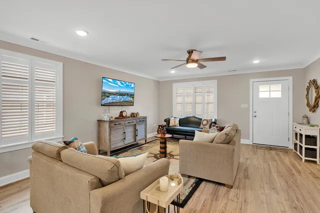 a living room with furniture and a window