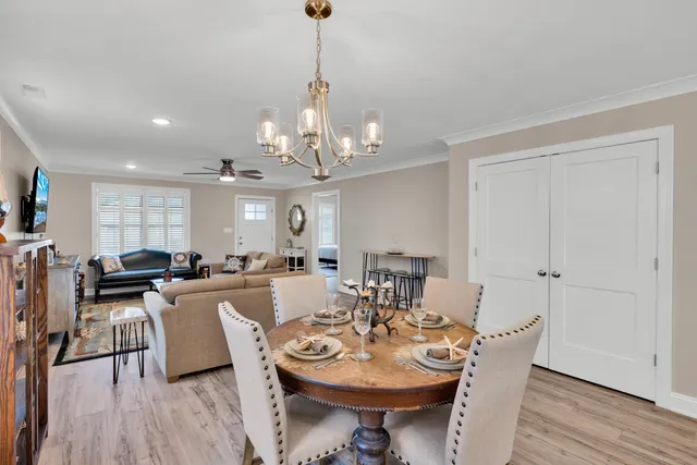 a kitchen with lots of counter top space and painting on the wall