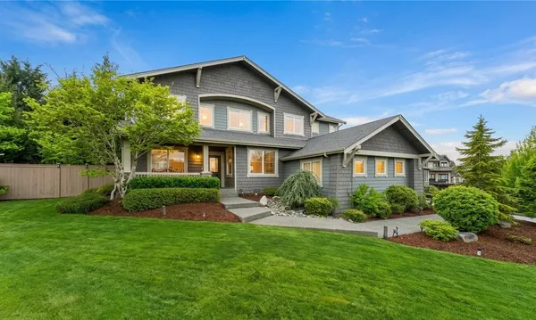 a front view of a house with a yard