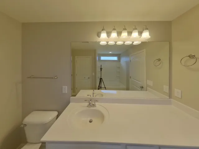 a bathroom with a sink and mirror