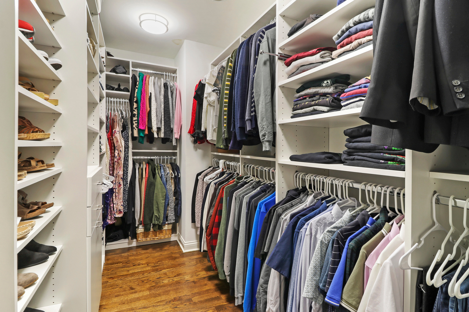 206 Spring Creek Road Barrington Hills, IL 60010 - Photo 21 of 56 a view of walk in closet with clothes and shoes