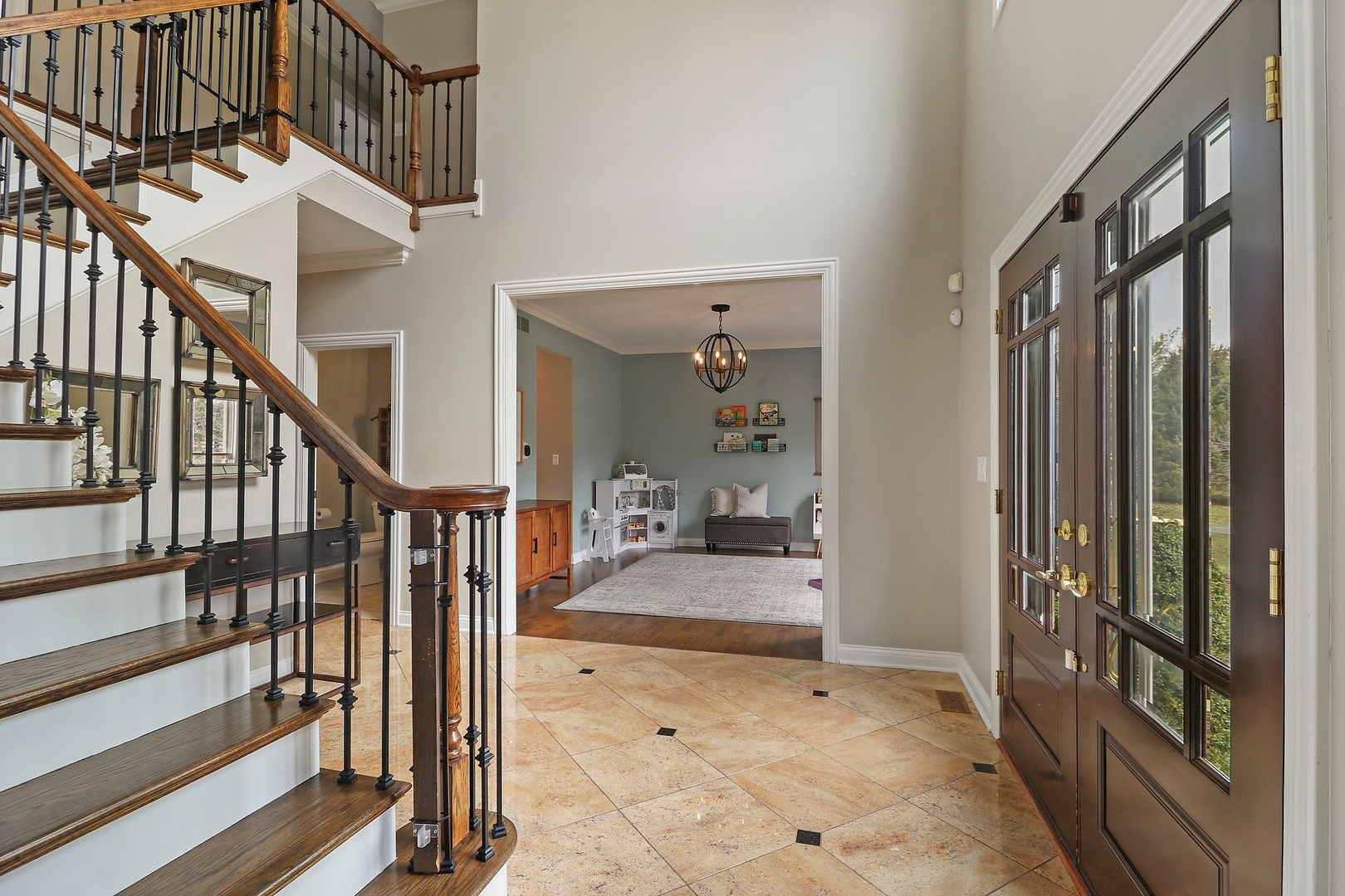 206 Spring Creek Road Barrington Hills, IL 60010 - Photo 3 of 56 a view of entryway and hall with wooden floor and windows