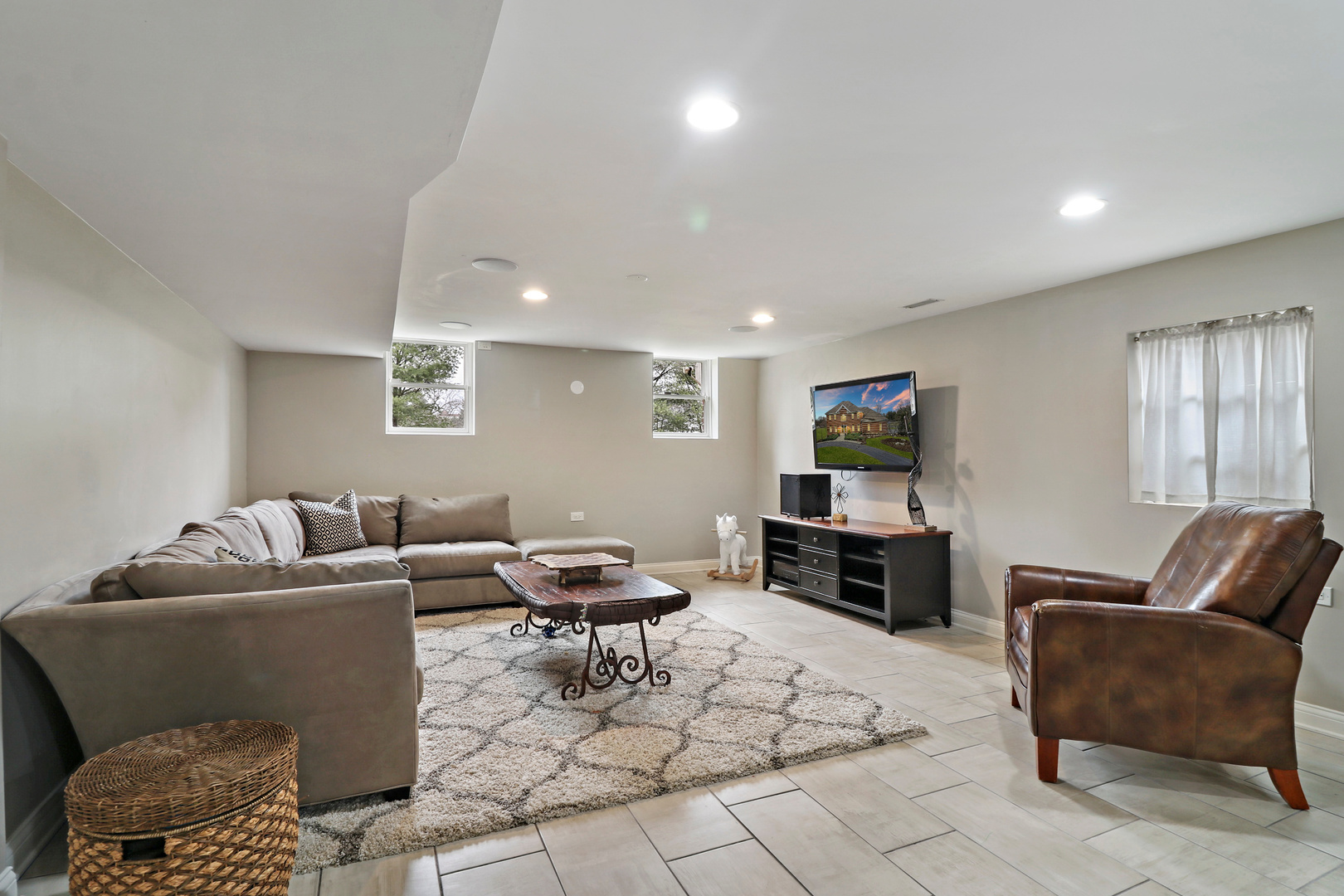 206 Spring Creek Road Barrington Hills, IL 60010 - Photo 33 of 56 a living room with furniture and a flat screen tv