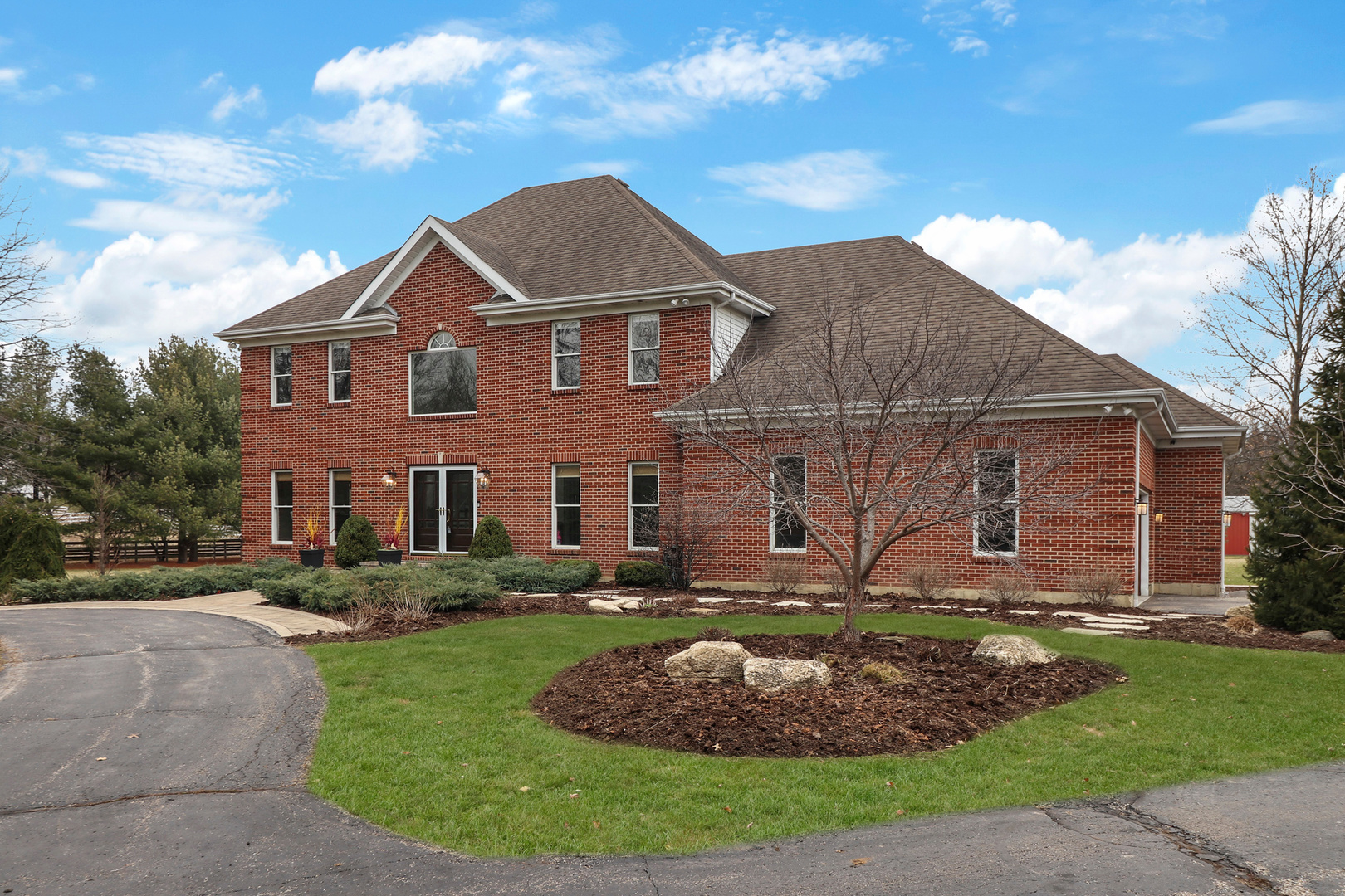 206 Spring Creek Road Barrington Hills, IL 60010 - Photo 37 of 56 a front view of a house with a yard