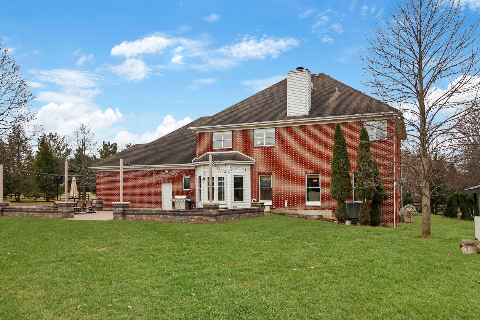 206 Spring Creek Road Barrington Hills, IL 60010 - Photo 47 of 56 a front view of house with a garden