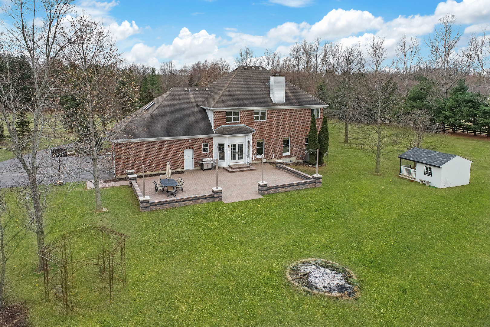 206 Spring Creek Road Barrington Hills, IL 60010 - Photo 49 of 56 a view of a house with a big yard