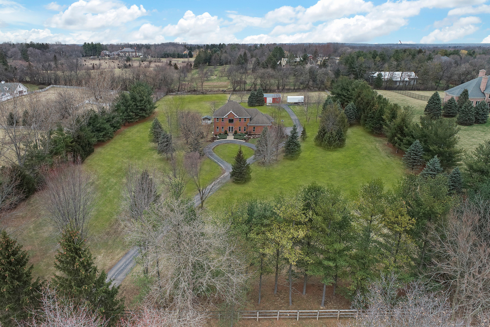 206 Spring Creek Road Barrington Hills, IL 60010 - Photo 51 of 56 a view of a lake with a houses