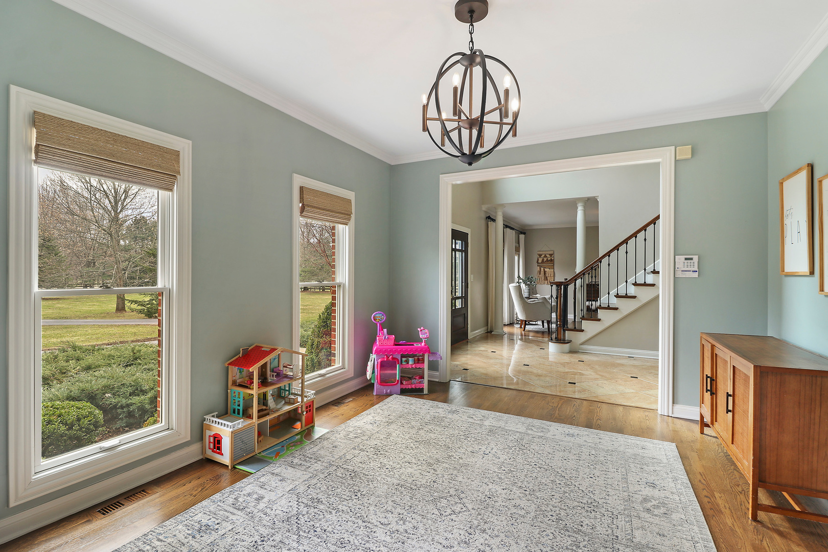 206 Spring Creek Road Barrington Hills, IL 60010 - Photo 6 of 56 a view of a livingroom with wooden floor and windows
