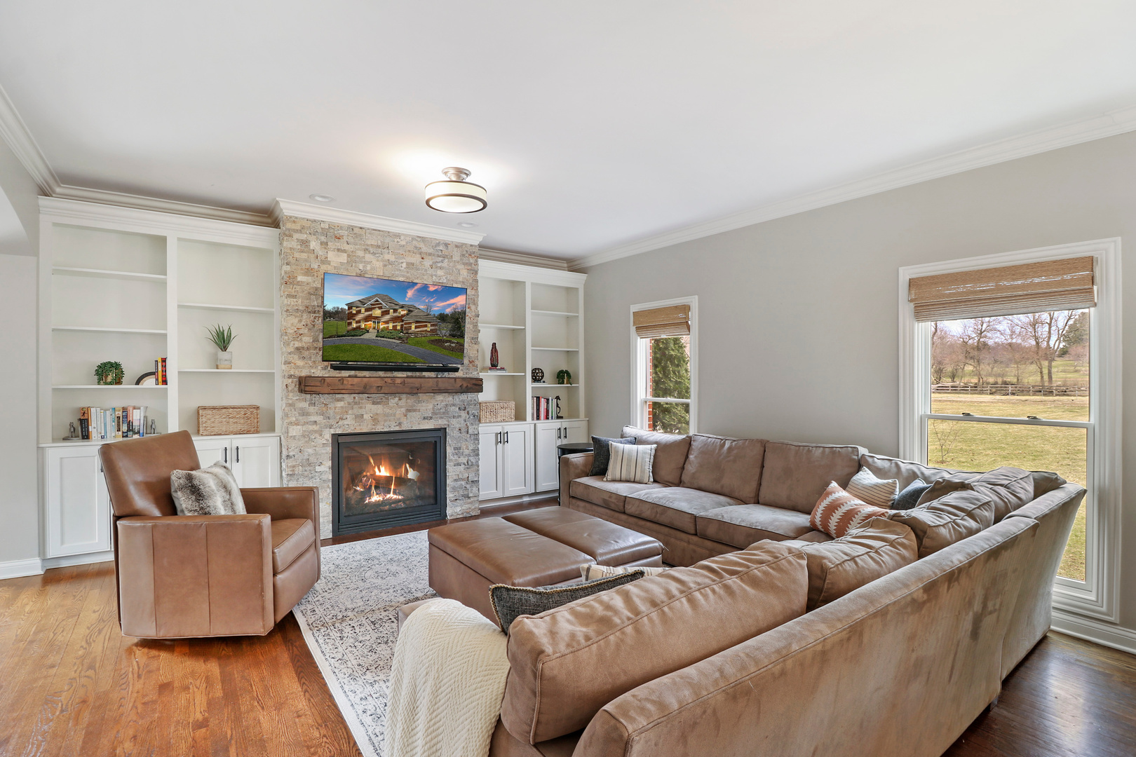 206 Spring Creek Road Barrington Hills, IL 60010 - Photo 8 of 56 a living room with furniture and a fireplace