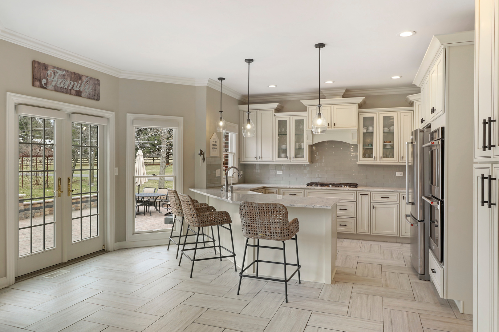 206 Spring Creek Road Barrington Hills, IL 60010 - Photo 10 of 56 a large kitchen with kitchen island granite countertop counter space a sink appliances and cabinets