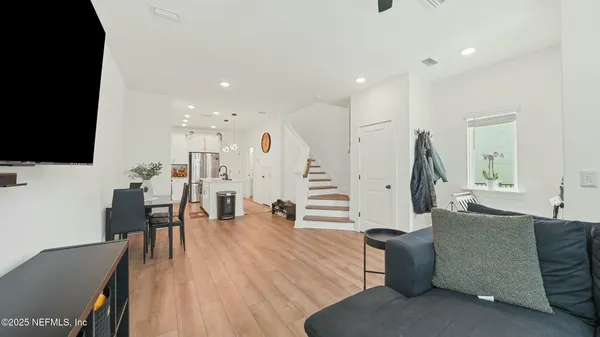 a view of living room with granite countertop furniture and a fireplace