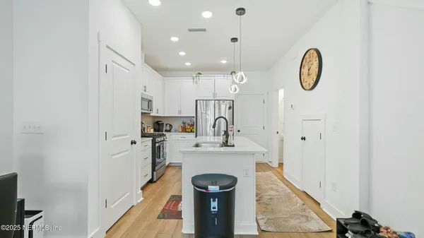 a kitchen with a sink stove and microwave