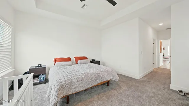 a bedroom with bed and a window