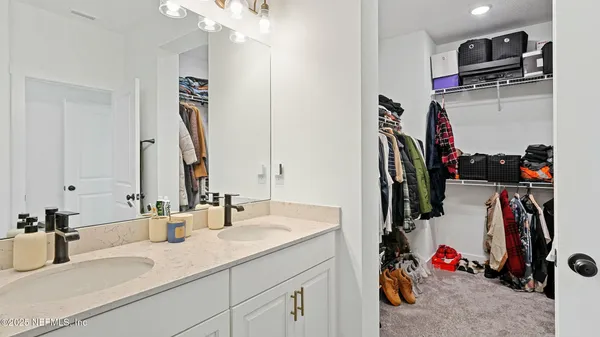 a bathroom with a shower and mirror