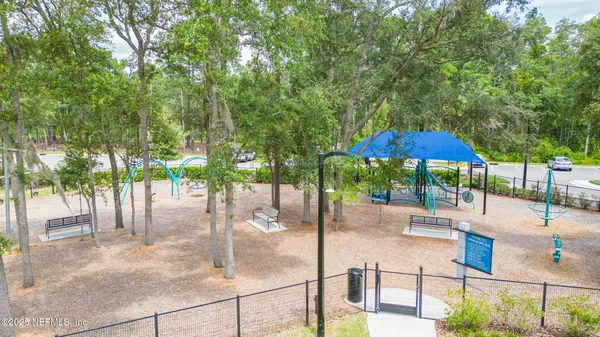 a view of a swimming pool with a yard