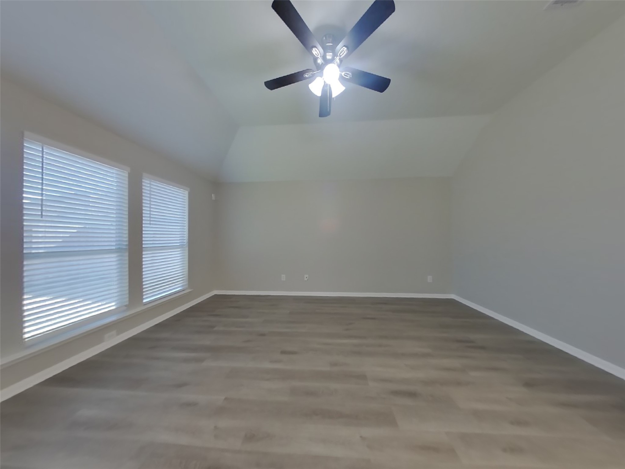 1318 Auburn View Lane Fresno, TX 77545 - Photo 2 of 18 wooden floor in an empty room with a window