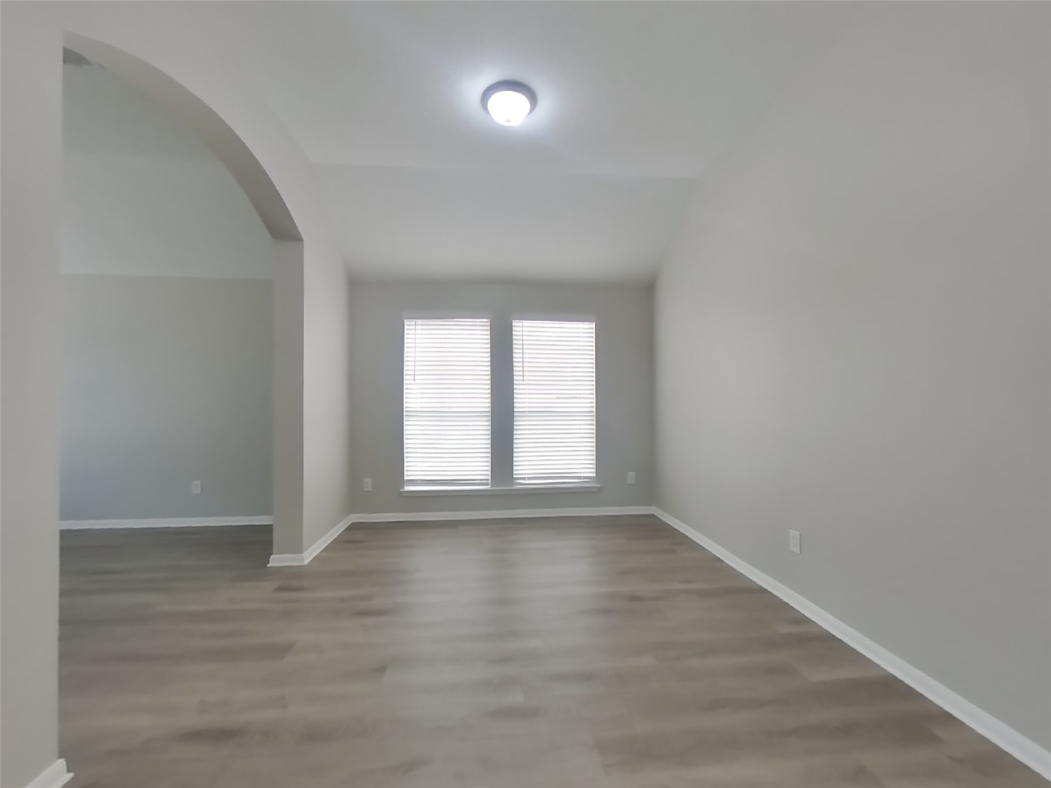 1318 Auburn View Lane Fresno, TX 77545 - Photo 5 of 18 a view of an empty room with wooden floor and a window