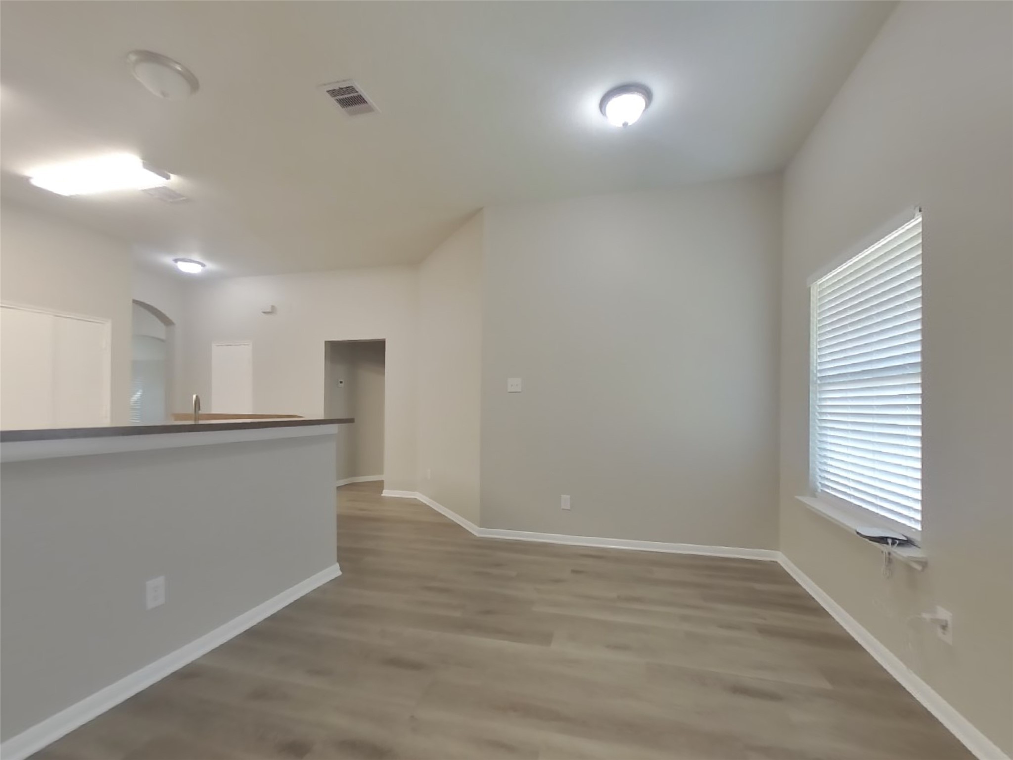 1318 Auburn View Lane Fresno, TX 77545 - Photo 6 of 18 an empty room with wooden floor and windows