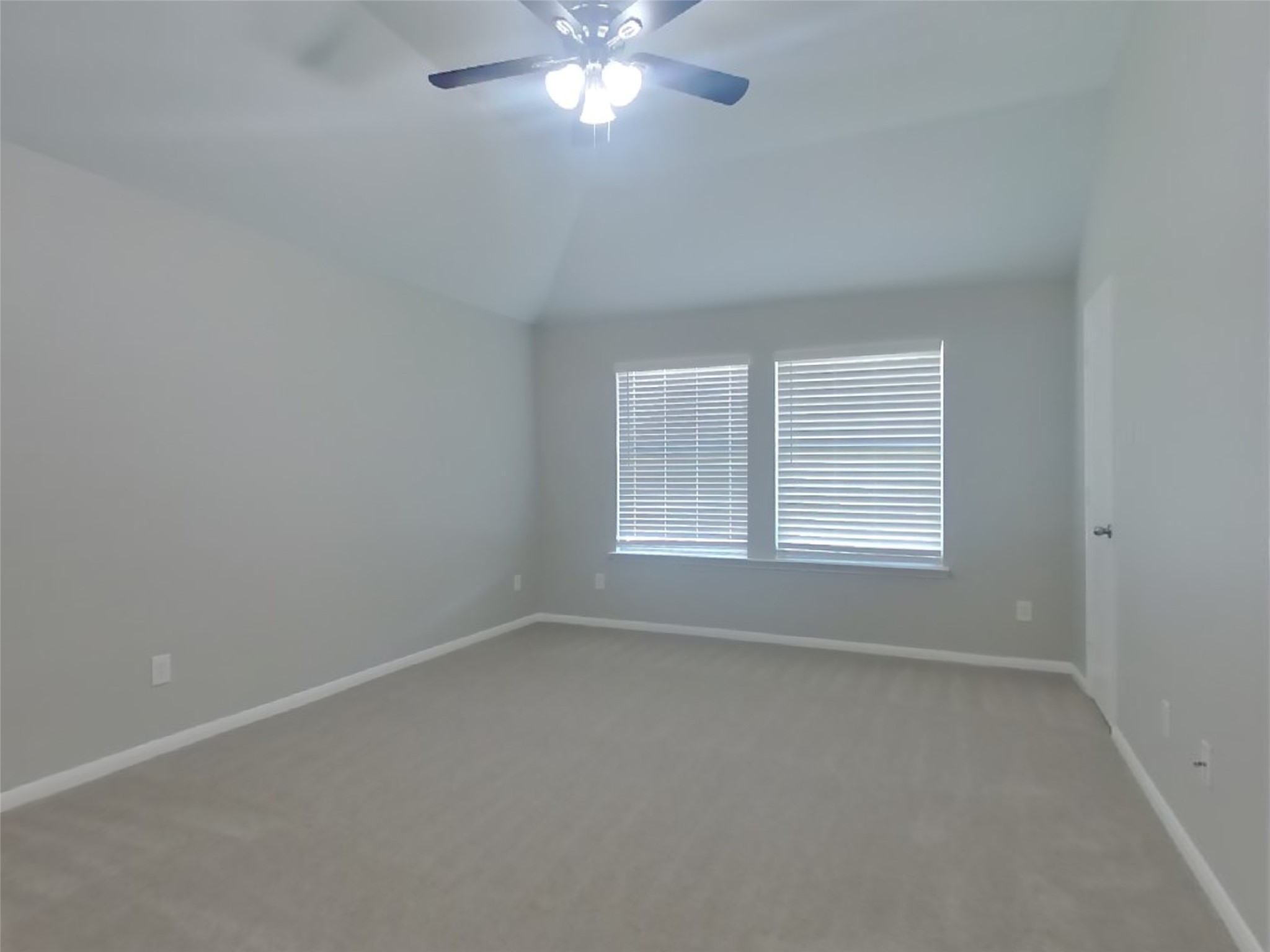 1318 Auburn View Lane Fresno, TX 77545 - Photo 8 of 18 an empty room with a window and a fan
