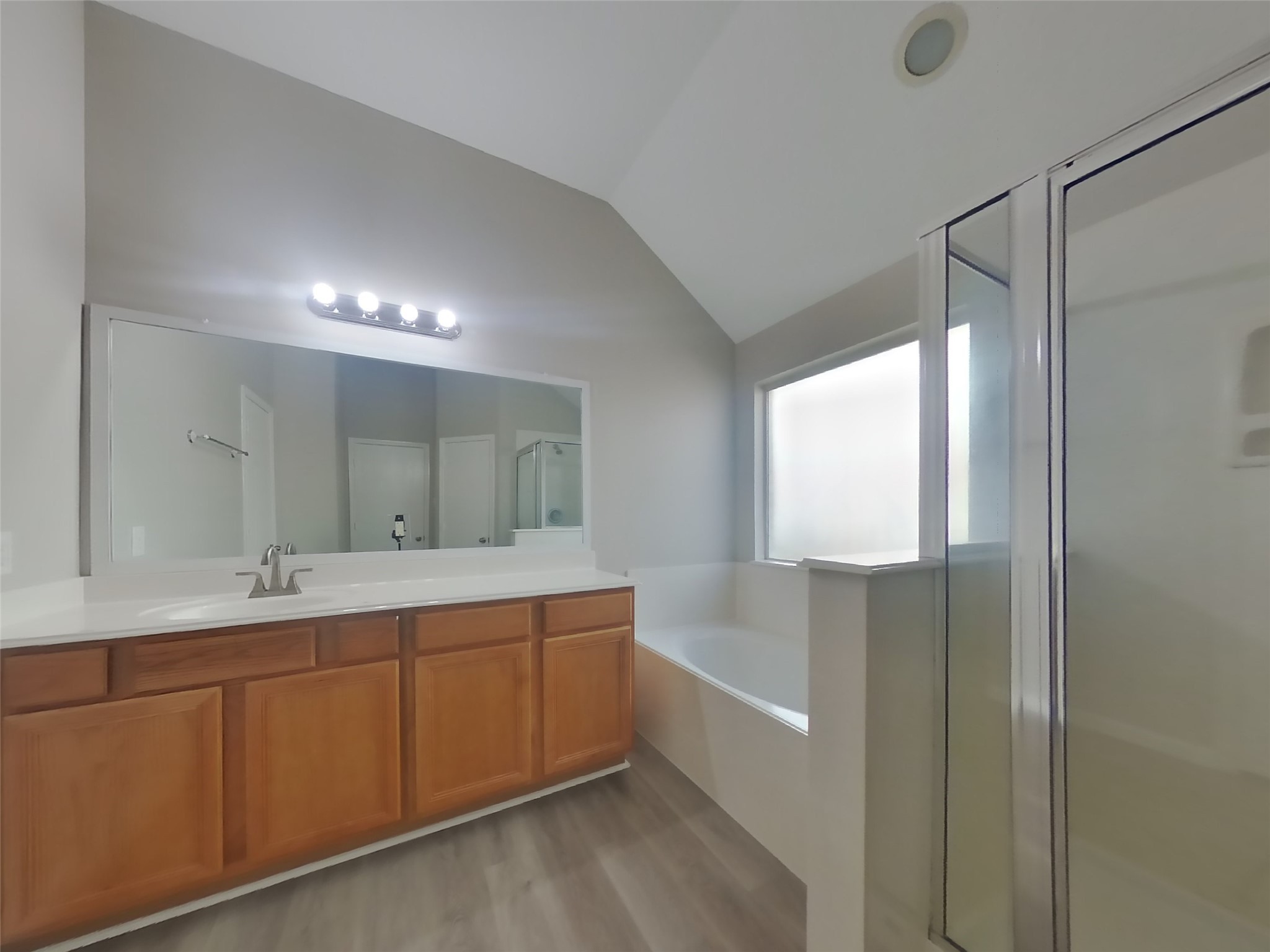 1318 Auburn View Lane Fresno, TX 77545 - Photo 9 of 18 a bathroom with a double vanity sink and mirror with bathtub