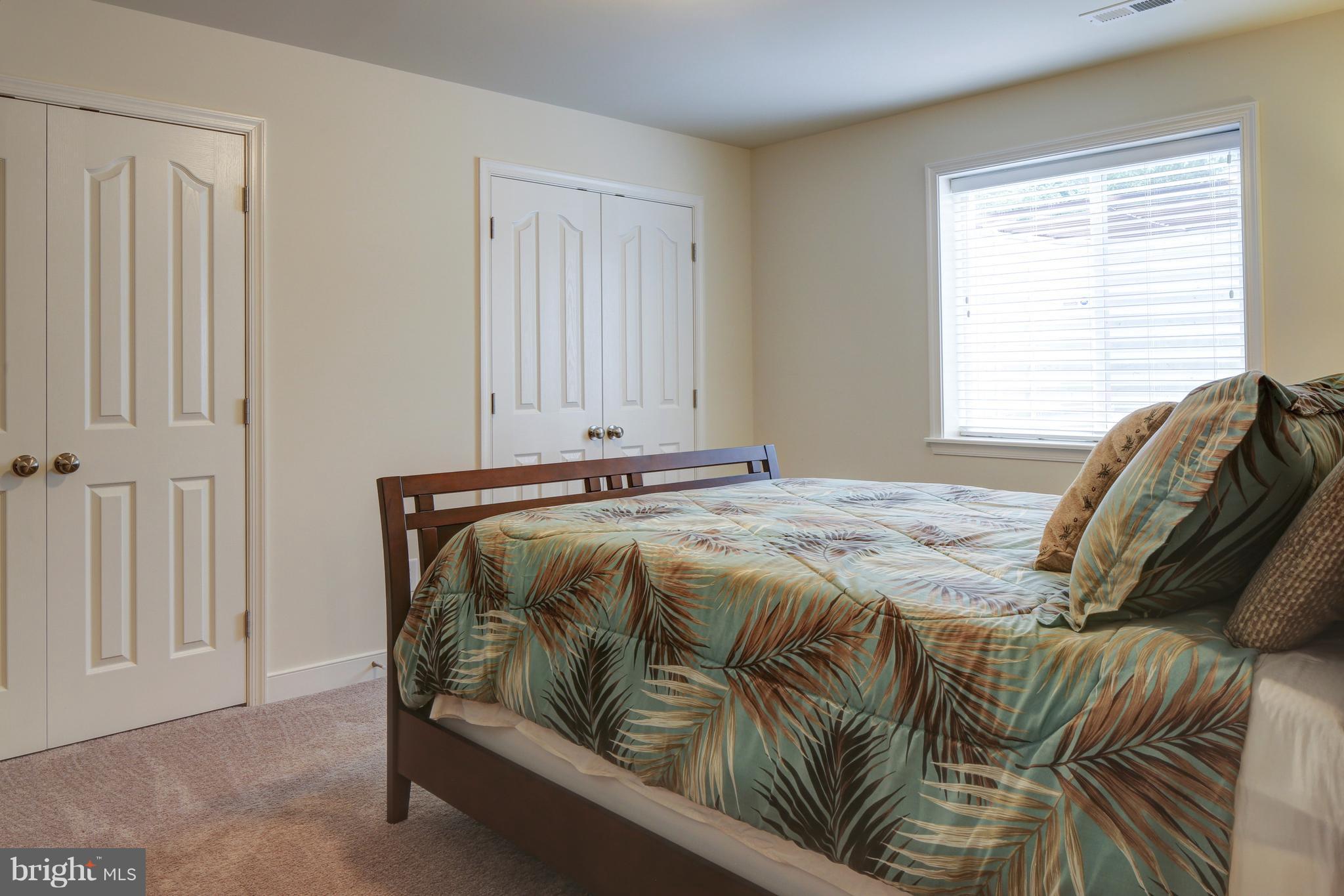 339 Chestnut Road Linthicum Heights, MD 21090 - Photo 19 of 30 a bedroom with a bed and a window