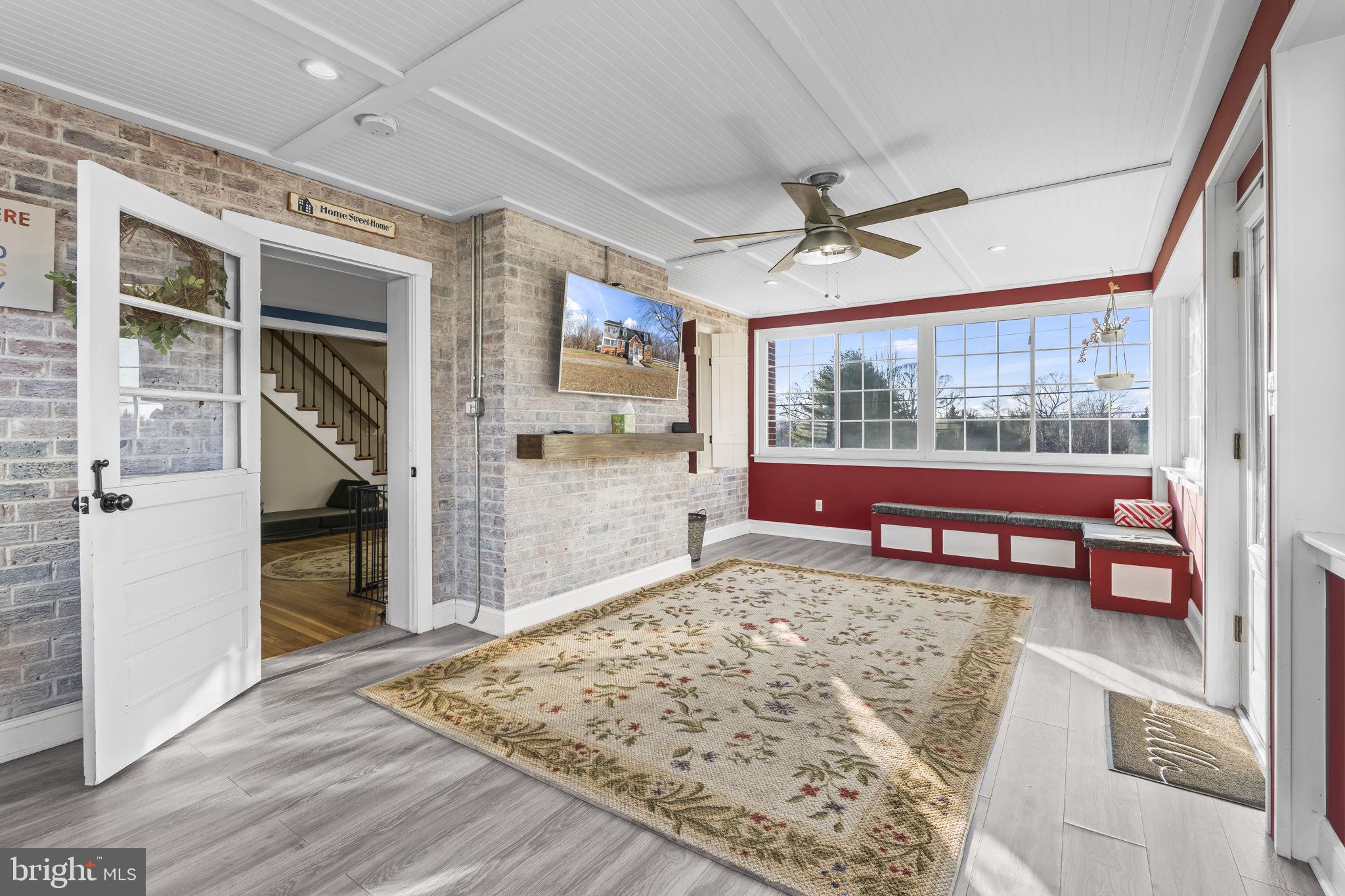 5920 Cherry Hill Road Huntingtown, MD 20639 - Photo 27 of 37 a living room with furniture and a rug