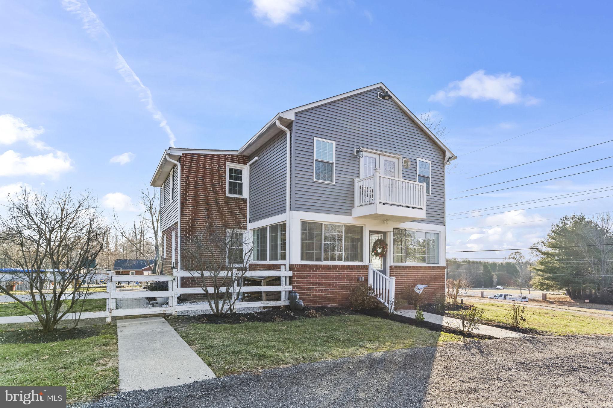 5920 Cherry Hill Road Huntingtown, MD 20639 - Photo 29 of 37 a view of a house with a yard and sitting area