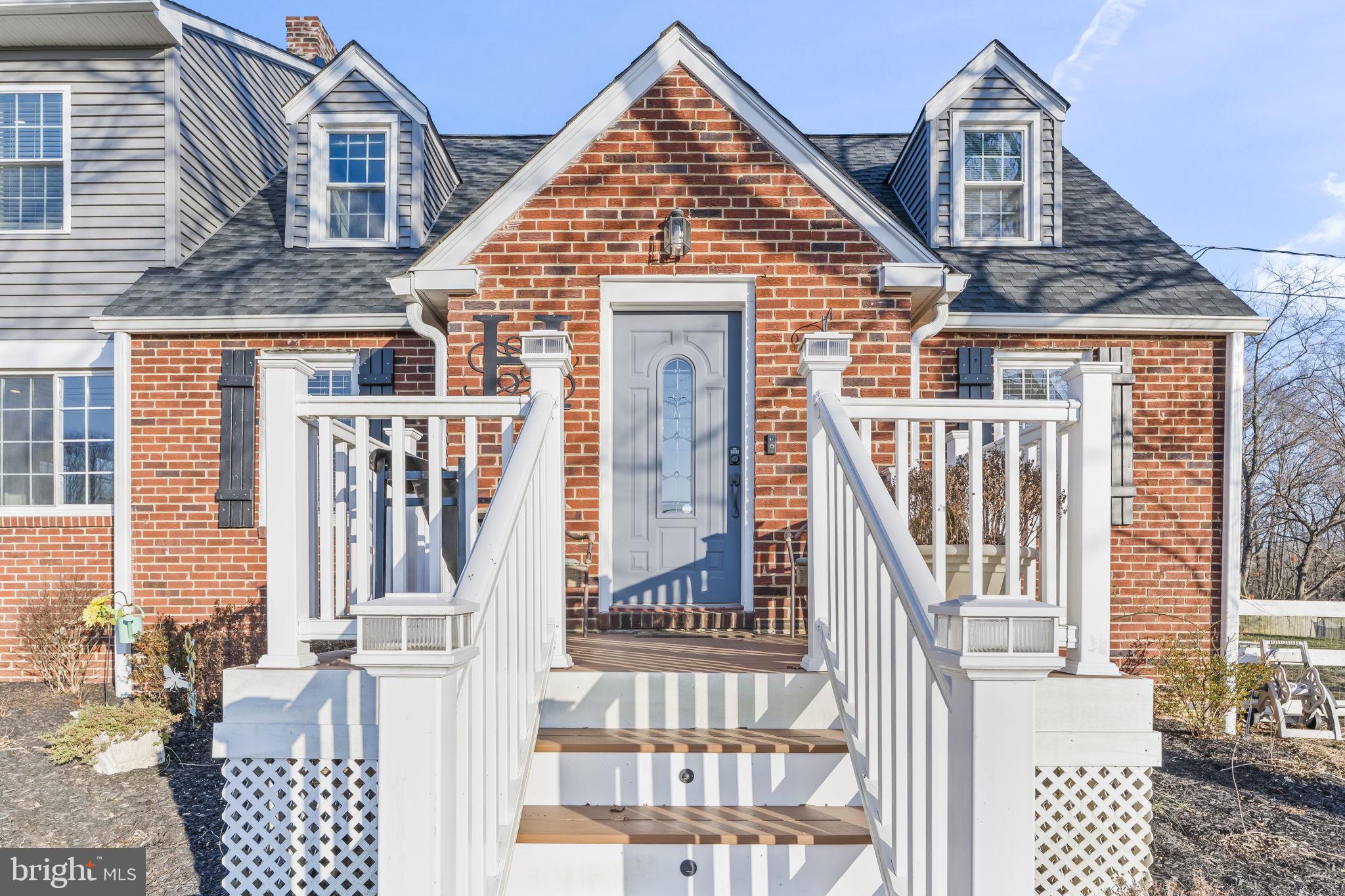 5920 Cherry Hill Road Huntingtown, MD 20639 - Photo 5 of 37 a view of a brick house with large windows