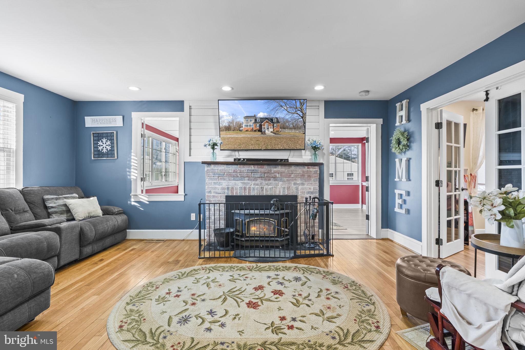 5920 Cherry Hill Road Huntingtown, MD 20639 - Photo 9 of 37 a living room with furniture and a fireplace