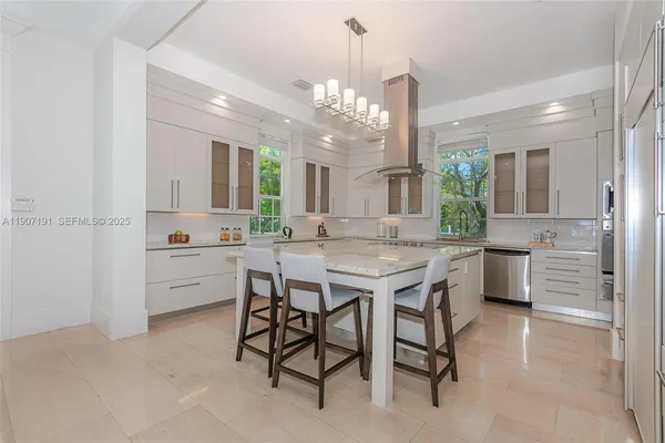 a view of a livingroom with furniture and a potted plant