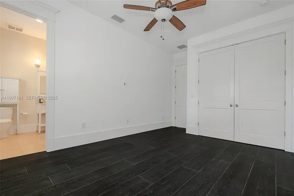 a living room with furniture and white walls