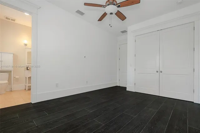 a living room with furniture and white walls