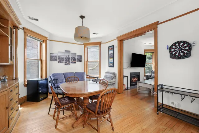 a view of a livingroom with furniture window and wooden floor