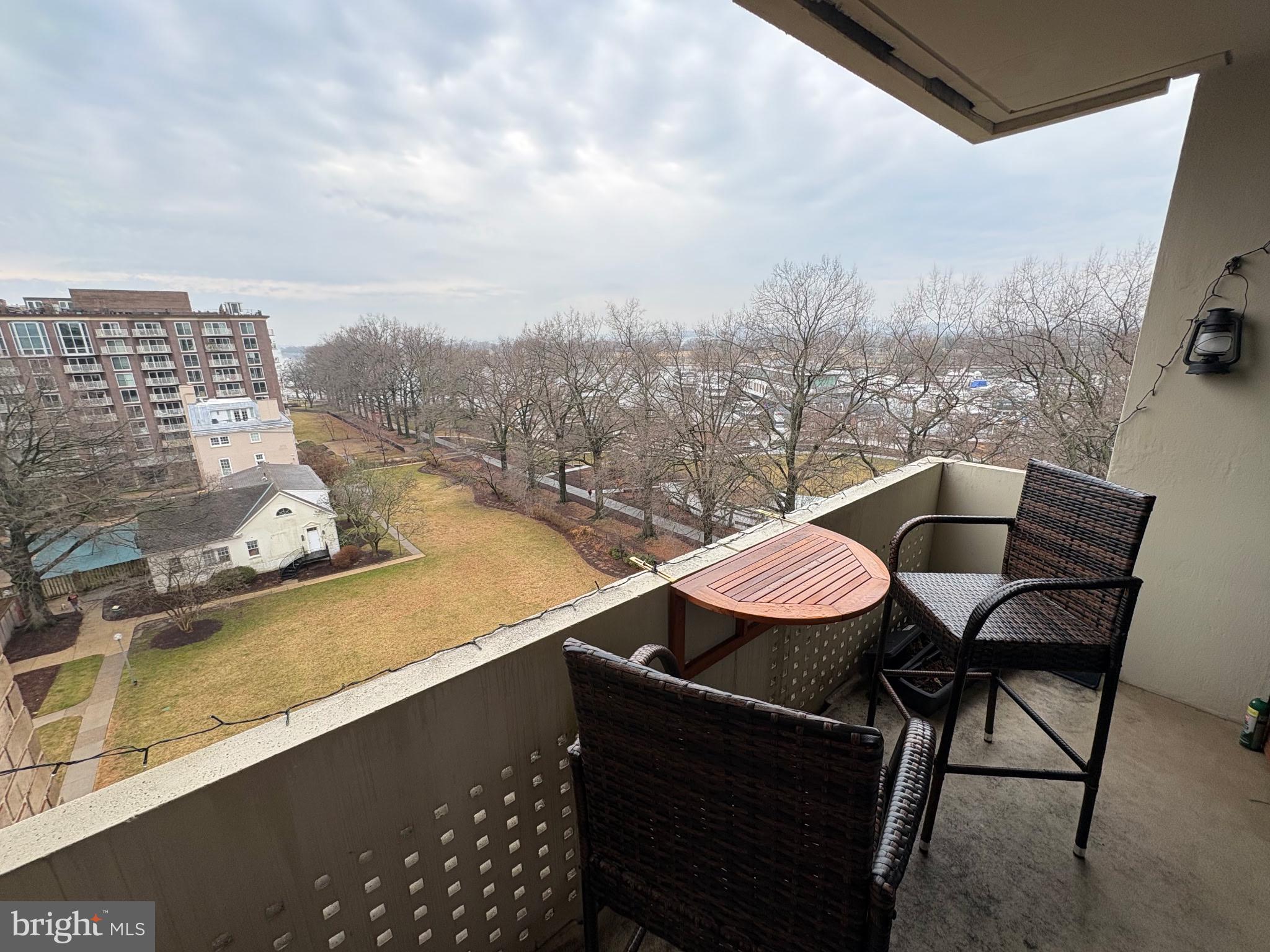 490 M Street Southwest, Unit W608 Washington, DC 20024 - Photo 8 of 12 a view of a balcony with table and chairs