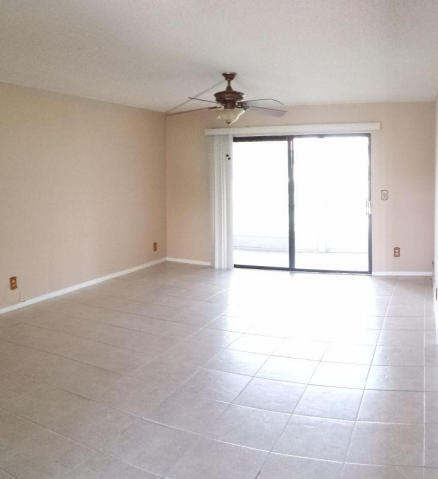 2500 Fiore Way, Unit 1110 Delray Beach, FL 33445 - Photo 5 of 12 a view of an empty room with a window